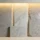 Natural stone slab samples including marble, terrazzo, granite, and limestone displayed in a showroom | Dongxing Stone Export FAQ