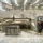 Technician operating CNC waterjet cutting machine for precision stone processing