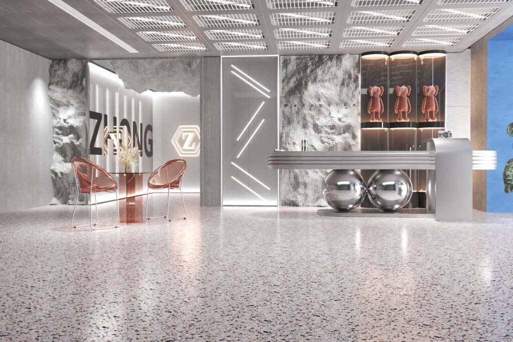 This modern commercial reception area features a polished light-colored inorganic terrazzo floor, blending durability and style. The smooth, speckled surface complements the sleek metallic furniture and contemporary decor, making it ideal for high-traffic public spaces like lobbies and retail stores.