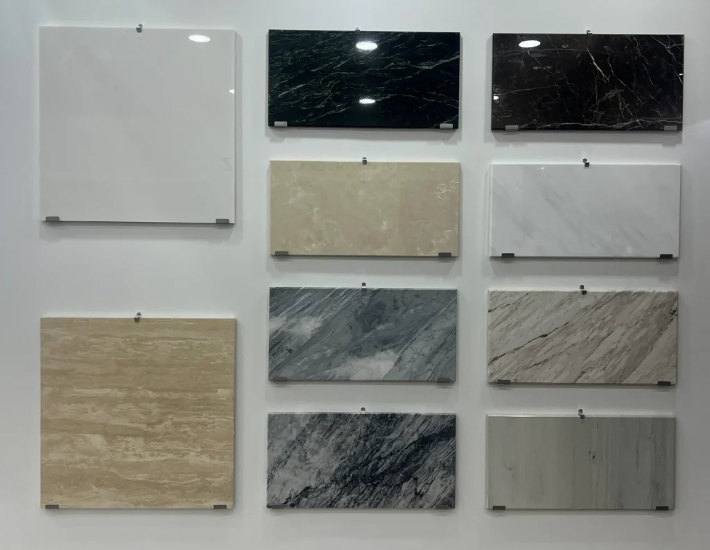 Dongxin natural marble and stone tile collection displayed at Thailand Stone Fair 2026, featuring Carrara, travertine, and black marble slabs for luxury interior design