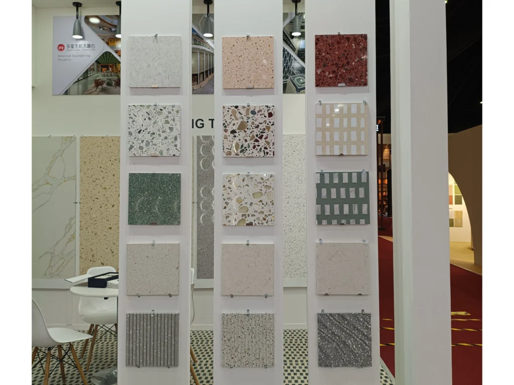 Multi-color inorganic terrazzo vertical sample display wall, colorful aggregate, solid color and hollow grid decorative terrazzo tiles for commercial & residential projects