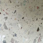 Dongxing inorganic terrazzo slabs polished surface, white base mixed with pink, grey, green and beige natural stone aggregates, high-gloss cement base terrazzo panel for commercial interior decoration