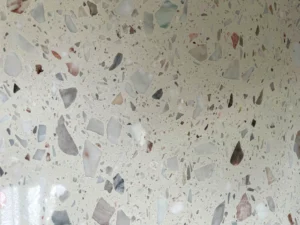 Dongxing inorganic terrazzo slabs polished surface, white base mixed with pink, grey, green and beige natural stone aggregates, high-gloss cement base terrazzo panel for commercial interior decoration
